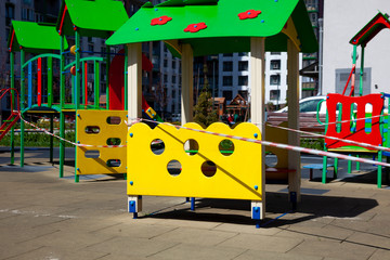 Indoor playgrounds during the coronavirus epidemic. A red ribbon is wrapped in a playground - a ban...