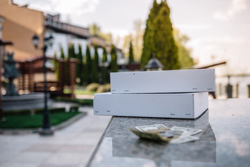 Crisis due to the coronavirus pandemic. Dollar bills with a protective mask on a gray wooden background. Global stock markets financial crisis and crash caused by the coronavirus outbreak