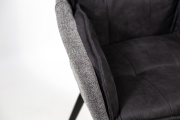 gray chair with black wooden legs on white background