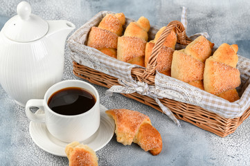 Sweet homemade cottage cheese buns with sugar and coffee cup
