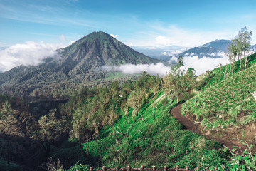 Photograph of high volcano with clouds on Java island