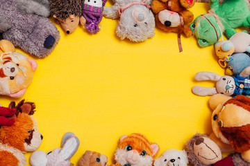 Fototapeta na wymiar children's soft toys for developing games on a yellow background