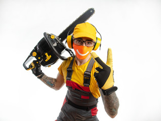 a guy in protective coveralls with a chainsaw on a white background