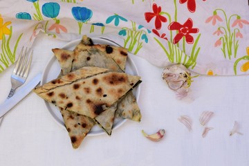 Slices of baked pied stuffed whit beet leafs and garlic/ Traditional Dalmatian cuisine/...