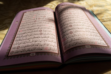 Colorful pages of the holy Quran book at sunset (Koran) | Islam | Ramadan Kareem and Eid Mubarak