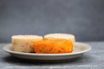 various cheese on gray ceramic background