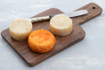 various cheese on gray ceramic background