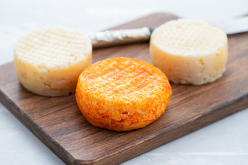 various cheese on gray ceramic background
