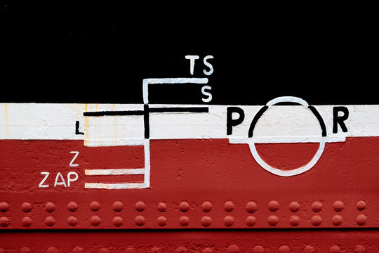 Closeup of waterline marked on the ship.