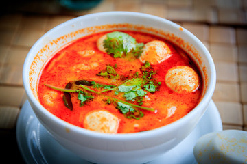 Spicy Thai soup Tom Yam with Coconut milk, Chili pepper and Seafood.
