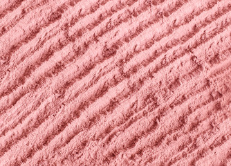 Pink bentonite clay powder texture close up. Diy alginate facial mask and body wrap recipe. Natural...