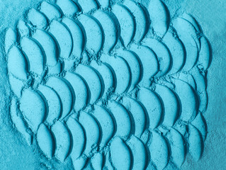 Blue bentonite facial clay powder (alginate mask, body wrap, eye shadow) texture close up,...