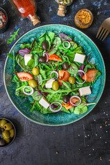 healthy salad
olives, lettuce, tomato and cheese
feta (greek salad, tasty vegetables snack) menu concept background. top view. copy space for text