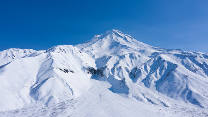 Beautiful view of Viluchinskiy Volcano near Petropavlovsk-Kamchatskiy city. Active volcano. Drone photo. Picturesque photo for a magazine. Kamchatka peninsula. Russia