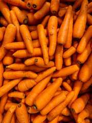 lots of ripe carrots to cook as a background