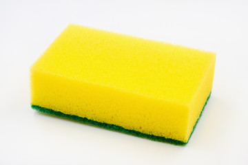 Yellow foam cleaning sponge for washing dishes, cleaning the bathroom and other household needs on a white background. Closeup