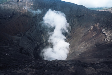 Photo of smoke volcano crater on Java island