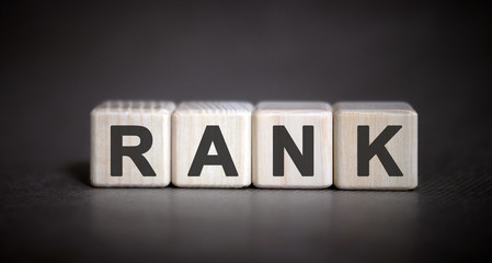 Obraz premium Rank - text on wooden cubes on a black background