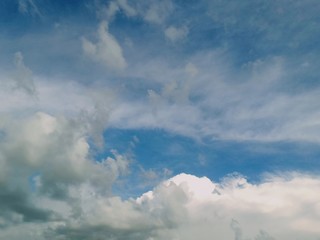 black and white clouds with blue sky