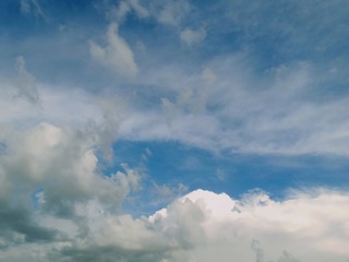 black and white clouds with blue sky