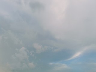 black and white clouds with blue sky