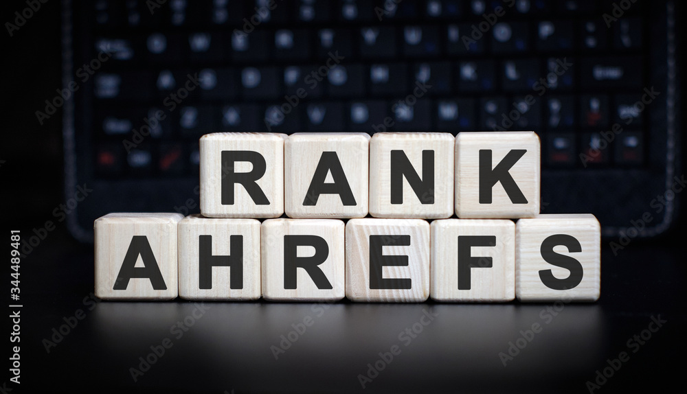 Poster rank ahrefs - text on wooden cubes on the background with keyboard
