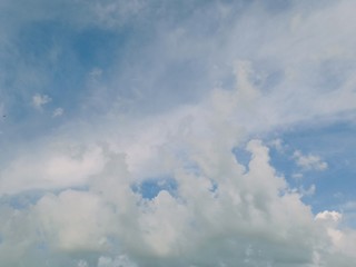 black and white clouds with blue sky