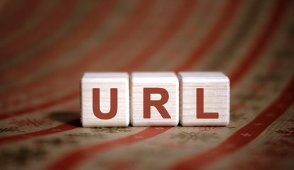 URL - concept on wooden cubes on a striped background