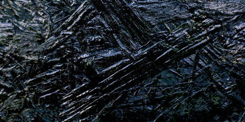 Background of beautiful artificial texture of graphite color.