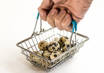 Quail eggs in a supermarket basket