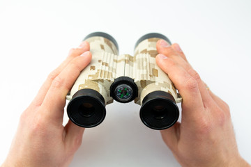 binoculars in the hands of a man