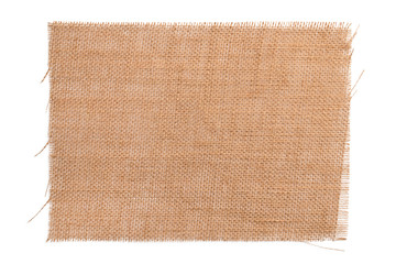 Old brown sackcloth from burlap. Wicker napkin isolated on a white background close-up. For design and titles