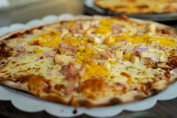 Pizza with ham,sweet corn and onion.