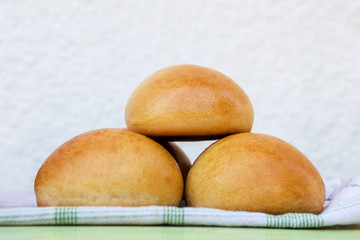 Group of fresh homemade burger buns.