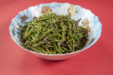 dish decorated with seasonal asparagus