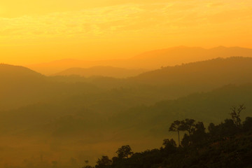 Mountain valley view with sunlight in the morning and orange sky background at Doi Luang Chiang Dao, Chiang Mai, Thailand. Landmark for travel of Northern of Thailand, Beauty of Nature and Landscape