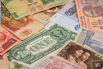 Fototapeta na wymiar background of various banknotes of different currencies of the world