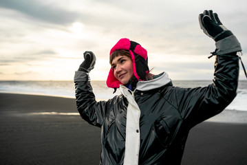beautiful woman in black jacket traveling around Iceland 