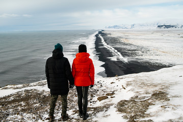 couple in love travels in winter in iceland