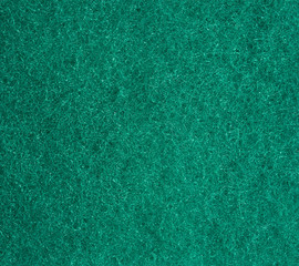 green texture of a kitchen sponge with fibers, full frame