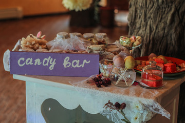 Naklejka na ściany i meble Details of a tasty candy bar with jugs of sweets