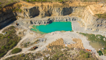 Quarry with beautiful blue water in it. Aerial view from drone