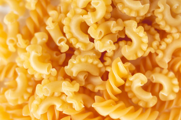 mixed Italian pasta as background
