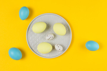 Easter eggs on a yellow background. Easter concept.