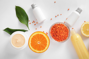 Natural cosmetics with ingredients on white background