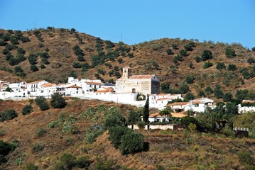 Fototapeta na wymiar View of a typical whitewashed Andalucian hill town (pueblo blanco), Benaque, Andalusia, Spain.