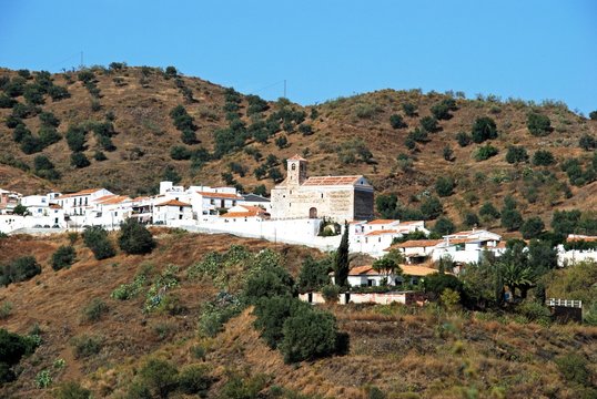 View of a typical whitewashed Andalucian hill town (pueblo blanco), Benaque, Andalusia, Spain.