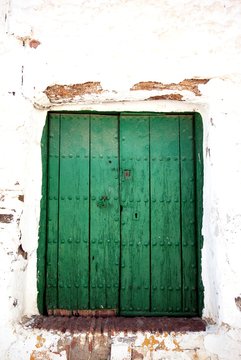 Rustic green wooden door, Benaque, Andalusia, Spain.
