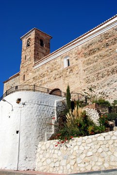 View of the church (Parroquia de la Encarnacion) in a whitewashed village, Benaque, Andalusia, Spain.