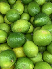 lots of ripe green limes for cooking a background